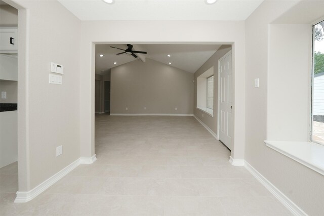 9607 Rumbling Wood Ln, Houston, TX 77086 - unfurnished room featuring ceiling fan, lofted ceiling, light tile patterned floors, baseboards, and recessed lighting