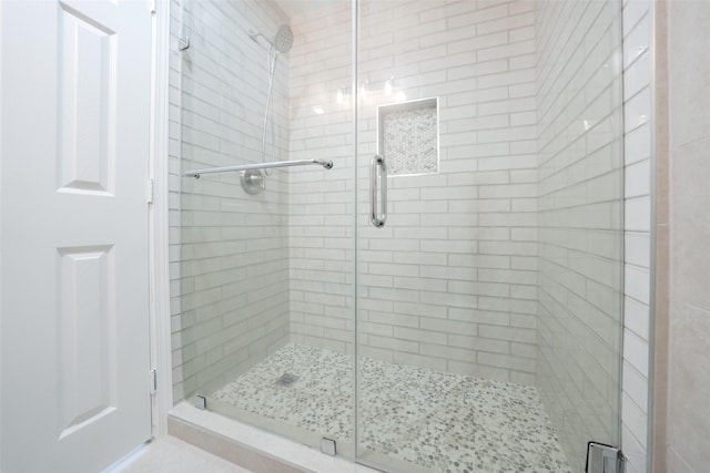 9607 Rumbling Wood Ln, Houston, TX 77086 - bathroom featuring a shower stall