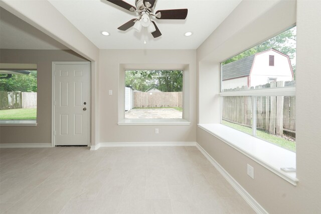 9607 Rumbling Wood Ln, Houston, TX 77086 - empty room with ceiling fan and baseboards