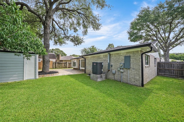 9607 Rumbling Wood Ln, Houston, TX 77086 - rear view of property with a patio area and central AC unit