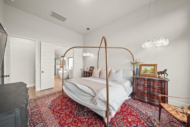 19002 Valentine Padlock Cir, Tomball, TX 77377 - bedroom featuring wood finished floors and ensuite bath