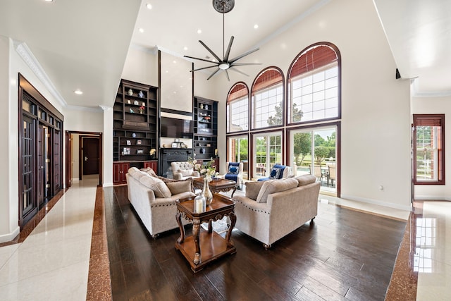 3818 Foolish Pleasure Ct, Richmond, TX 77406 - living room featuring crown molding, recessed lighting, a towering ceiling, healthy amount of natural light, and baseboards