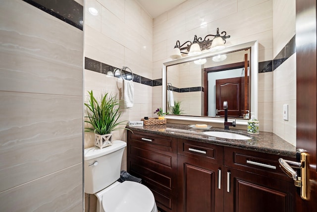 3818 Foolish Pleasure Ct, Richmond, TX 77406 - bathroom with tile walls, vanity, and toilet