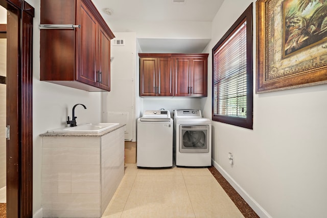 3818 Foolish Pleasure Ct, Richmond, TX 77406 - laundry room featuring cabinet space, independent washer and dryer, baseboards, and light tile patterned floors