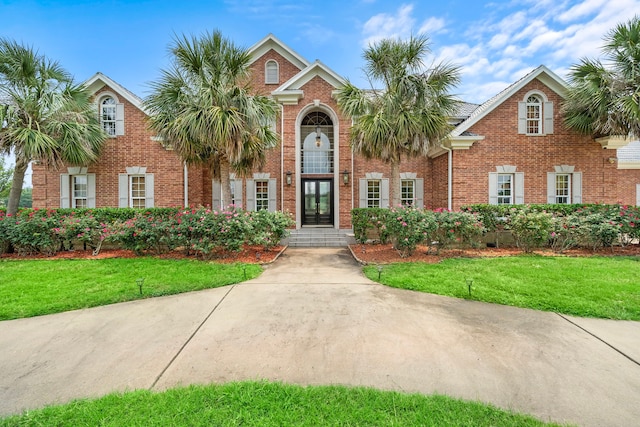 3818 Foolish Pleasure Ct, Richmond, TX 77406 - view of front facade featuring a front lawn and brick siding