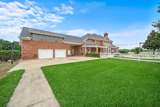 3818 Foolish Pleasure Ct, Richmond, TX 77406 - view of front of house with brick siding, a front yard, a chimney, concrete driveway, and an attached garage