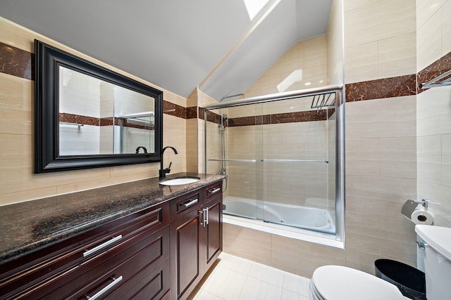 3818 Foolish Pleasure Ct, Richmond, TX 77406 - full bathroom featuring toilet, tiled shower / bath combo, tile walls, tile patterned flooring, and vanity