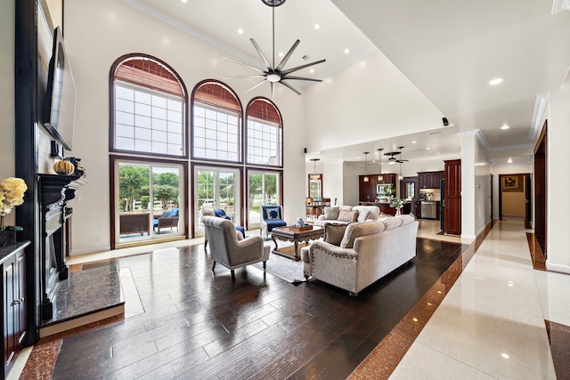 3818 Foolish Pleasure Ct, Richmond, TX 77406 - living area featuring crown molding, a fireplace, baseboards, a high ceiling, and recessed lighting