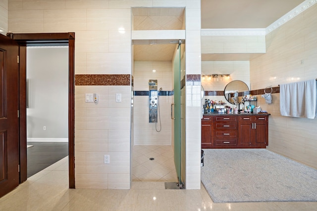 3818 Foolish Pleasure Ct, Richmond, TX 77406 - bathroom with a shower stall, tile patterned floors, vanity, and tile walls