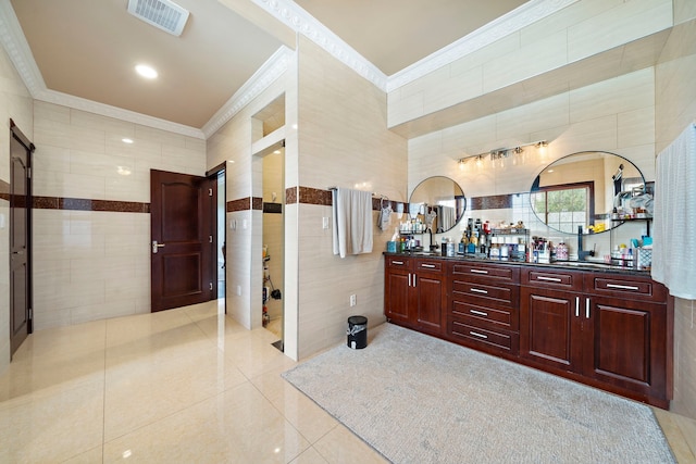 3818 Foolish Pleasure Ct, Richmond, TX 77406 - bathroom with crown molding, tile walls, tile patterned floors, and double vanity