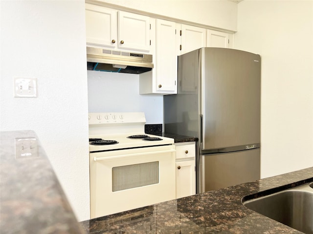 12550 Whittington Dr Unit 712, Houston, TX 77077 - kitchen featuring under cabinet range hood, white electric range, freestanding refrigerator, white cabinetry, and dark stone counters