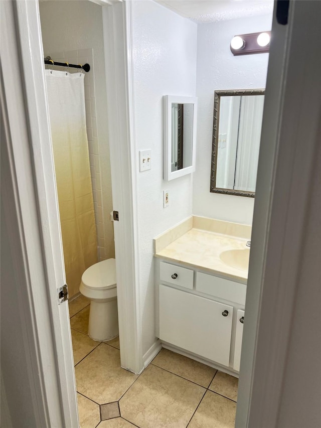 12550 Whittington Dr Unit 712, Houston, TX 77077 - bathroom featuring tile patterned floors, vanity, toilet, and a shower with shower curtain