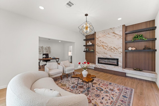 322 N Wilcrest Dr, Houston, TX 77079 - living room featuring an office area, wood finished floors, recessed lighting, a high end fireplace, and baseboards