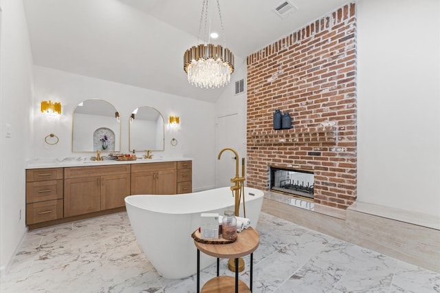 322 N Wilcrest Dr, Houston, TX 77079 - full bath featuring marble finish flooring, a freestanding bath, vanity, a fireplace, and high vaulted ceiling
