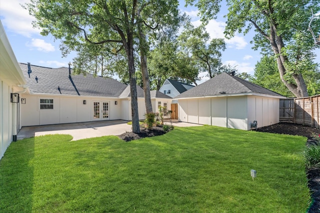 322 N Wilcrest Dr, Houston, TX 77079 - back of property with french doors, board and batten siding, a patio, and a shingled roof