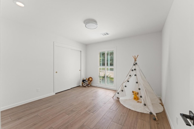 322 N Wilcrest Dr, Houston, TX 77079 - rec room featuring light wood-style floors and baseboards