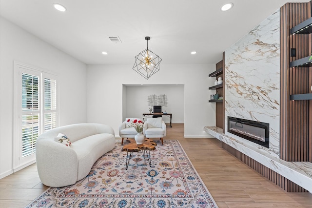 322 N Wilcrest Dr, Houston, TX 77079 - living room with recessed lighting, light wood finished floors, a premium fireplace, and baseboards