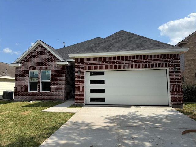 3826 St Simon Manor Dr, Houston, TX 77047 - view of front facade with central AC, brick siding, a shingled roof, and driveway