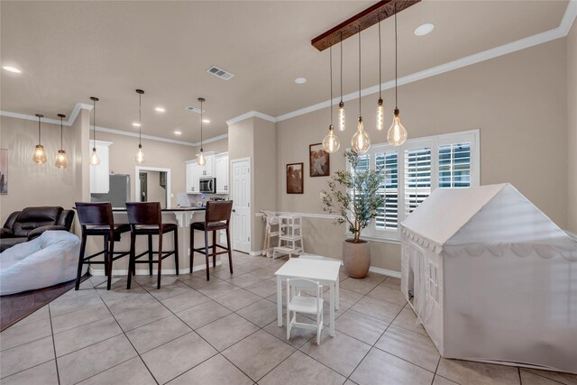 312 Fox Xing, Burnet, TX 78611 - dining space featuring light tile patterned floors, crown molding, recessed lighting, and baseboards
