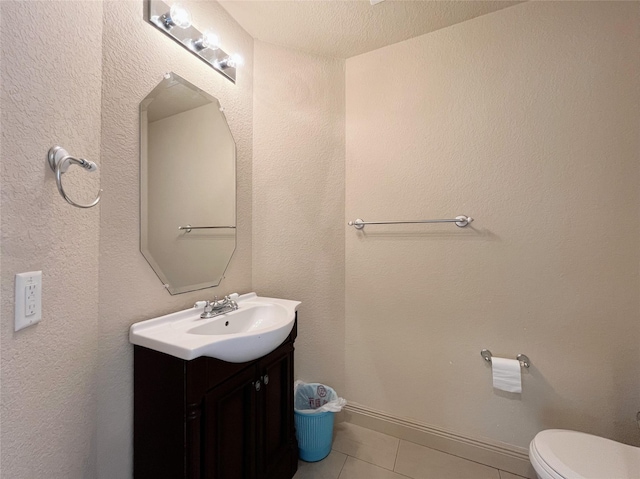 20516 Hawkins Manor Ln, Katy, TX 77449 - half bath featuring tile patterned floors, vanity, toilet, and baseboards
