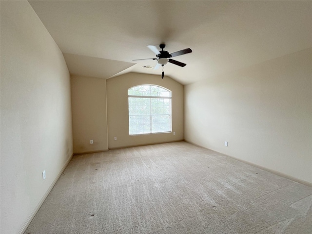 20516 Hawkins Manor Ln, Katy, TX 77449 - empty room with ceiling fan, carpet flooring, vaulted ceiling, and baseboards