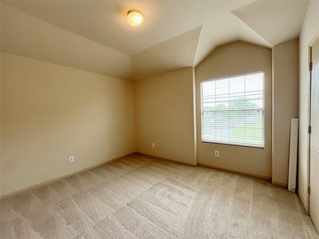 20516 Hawkins Manor Ln, Katy, TX 77449 - bonus room featuring light colored carpet, vaulted ceiling, and baseboards