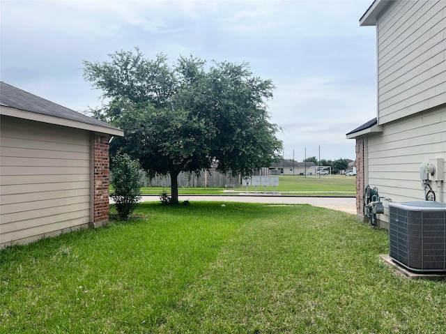20516 Hawkins Manor Ln, Katy, TX 77449 - view of grassy yard with cooling unit