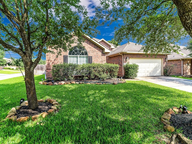 25203 Auburn Terrace Dr, Spring, TX 77389 - view of front of home with brick siding, a garage, and driveway