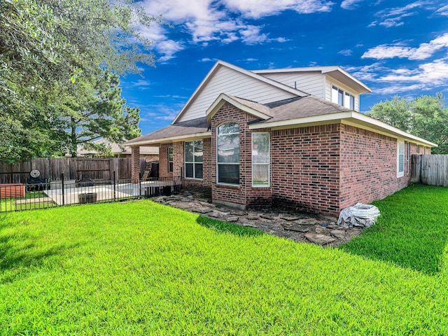 25203 Auburn Terrace Dr, Spring, TX 77389 - back of property featuring a patio, brick siding, and a shingled roof