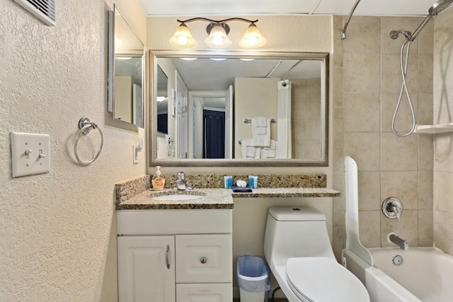6102 Seawall Blvd Unit 260, Galveston, TX 77551 - full bath with a textured wall, bathtub / shower combination, vanity, and toilet