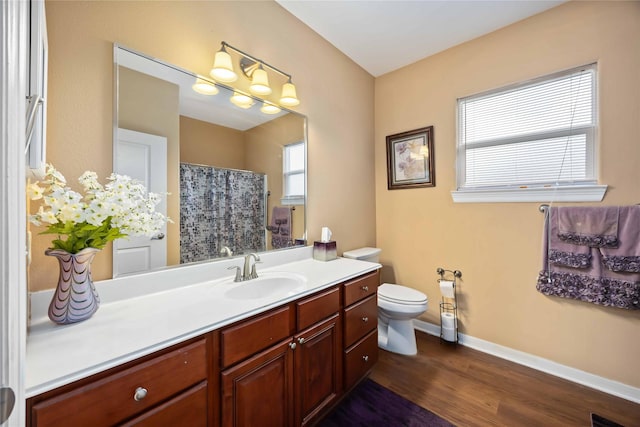 2709 Virginia St, La Marque, TX 77568 - bathroom with vanity, wood finished floors, toilet, baseboards, and curtained shower
