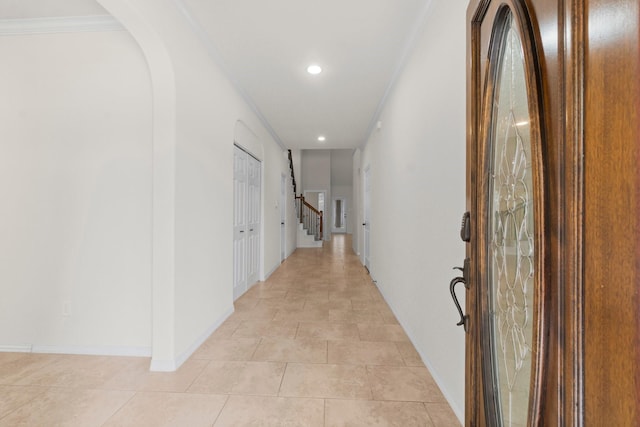 9131 Durango Point Ln, Houston, TX 77070 - hallway featuring recessed lighting, baseboards, ornamental molding, stairs, and arched walkways