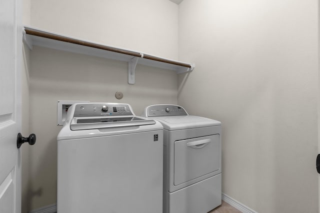 9131 Durango Point Ln, Houston, TX 77070 - washroom featuring washer and dryer and baseboards