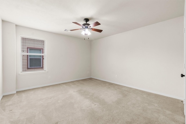 9131 Durango Point Ln, Houston, TX 77070 - unfurnished room featuring light carpet, a ceiling fan, and baseboards