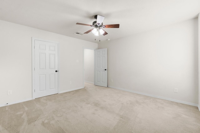 9131 Durango Point Ln, Houston, TX 77070 - unfurnished bedroom with light colored carpet, baseboards, and ceiling fan