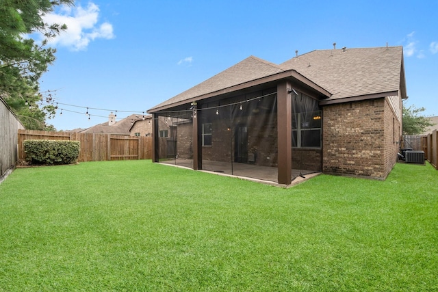 9131 Durango Point Ln, Houston, TX 77070 - back of house with a shingled roof, brick siding, cooling unit, and a patio