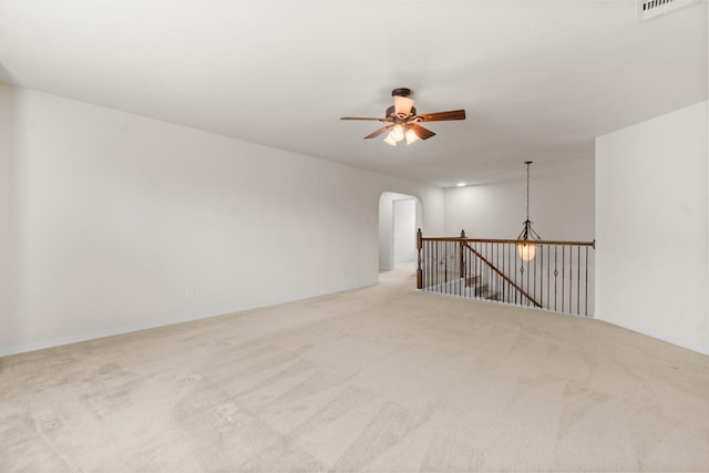 9131 Durango Point Ln, Houston, TX 77070 - unfurnished room with ceiling fan, carpet flooring, and arched walkways