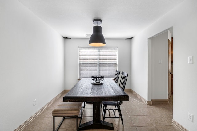 6907 Autumn Rain Ln, Spring, TX 77379 - dining area with light tile patterned flooring and baseboards