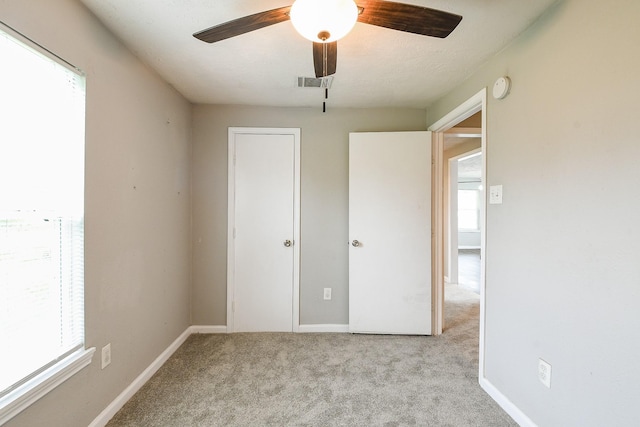 312 Hemphill St, Texas City, TX 77591 - unfurnished bedroom featuring carpet floors, a ceiling fan, and baseboards
