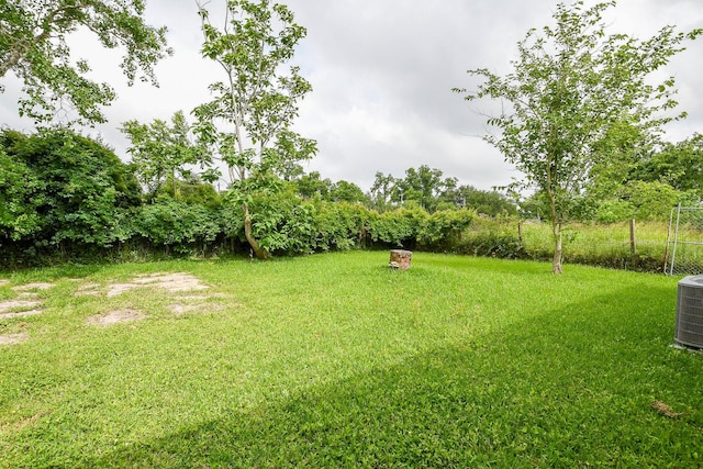 312 Hemphill St, Texas City, TX 77591 - view of green lawn featuring central AC