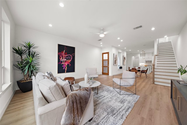 5238 Larkin St, Houston, TX 77007 - living area featuring stairway, ceiling fan, light wood-style flooring, recessed lighting, and baseboards