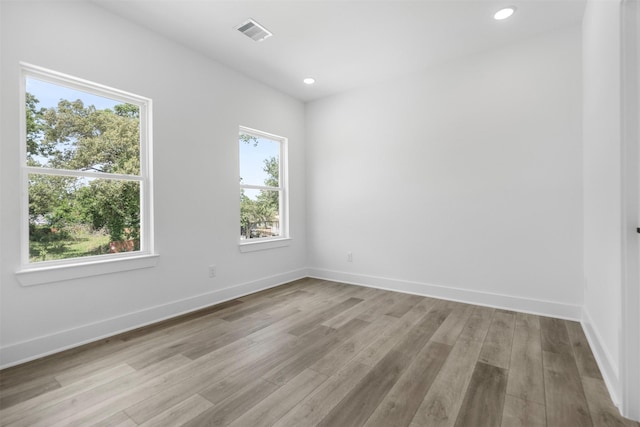 2475 Carmel St A/B, Unit A/B Houston, TX 77091 - unfurnished room with light wood-type flooring, baseboards, and recessed lighting