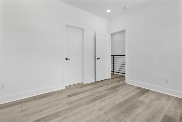 2475 Carmel St A/B, Unit A/B Houston, TX 77091 - unfurnished bedroom featuring light wood-style flooring, baseboards, and recessed lighting