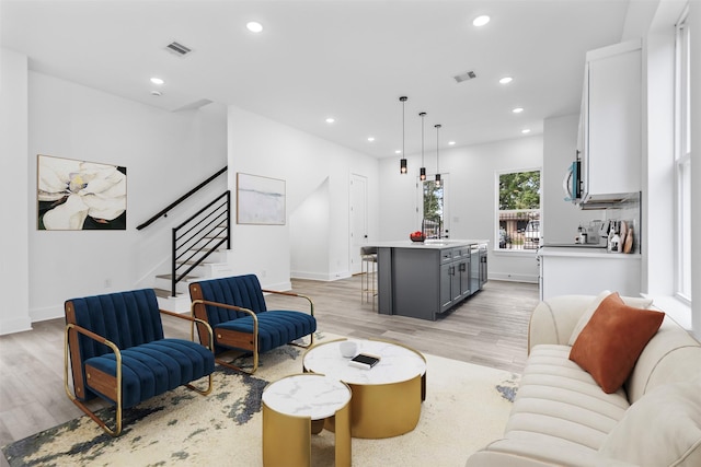 2475 Carmel St A/B, Unit A/B Houston, TX 77091 - living area with stairs, light wood-type flooring, recessed lighting, and baseboards