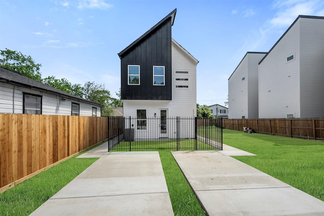 2475 Carmel St A/B, Unit A/B Houston, TX 77091 - back of property featuring board and batten siding and a patio
