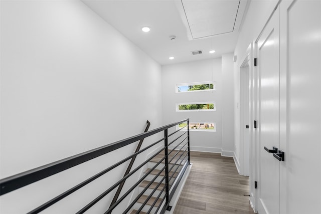 2475 Carmel St A/B, Unit A/B Houston, TX 77091 - staircase featuring attic access, wood finished floors, recessed lighting, and baseboards