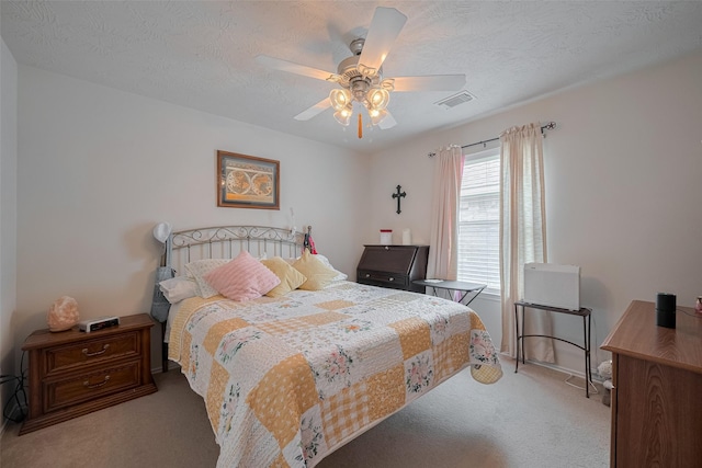 18019 Iris Edge Way, Cypress, TX 77429 - carpeted bedroom with a textured ceiling, ceiling fan, and baseboards