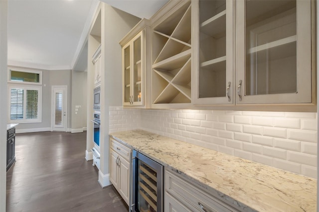 1518 Hillendahl Blvd, Houston, TX 77055 - indoor dry bar with wine cooler, decorative backsplash, dark wood-style flooring, crown molding, and stainless steel appliances