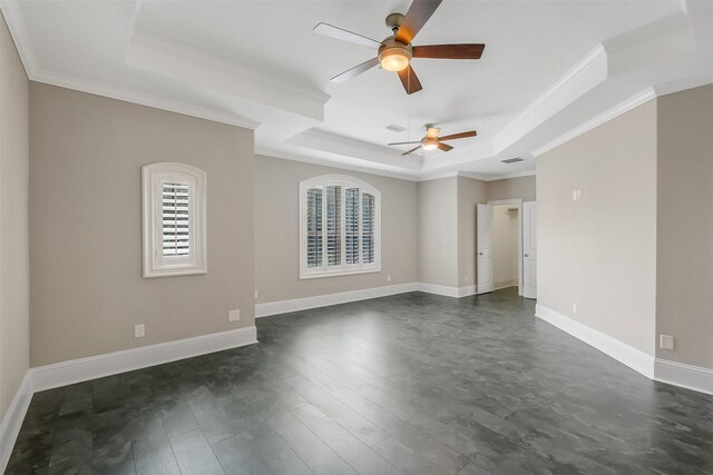 1518 Hillendahl Blvd, Houston, TX 77055 - empty room with a tray ceiling, ceiling fan, crown molding, dark wood-type flooring, and baseboards