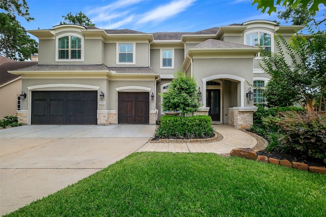 1518 Hillendahl Blvd, Houston, TX 77055 - view of front of property featuring stucco siding, an attached garage, stone siding, driveway, and a front yard